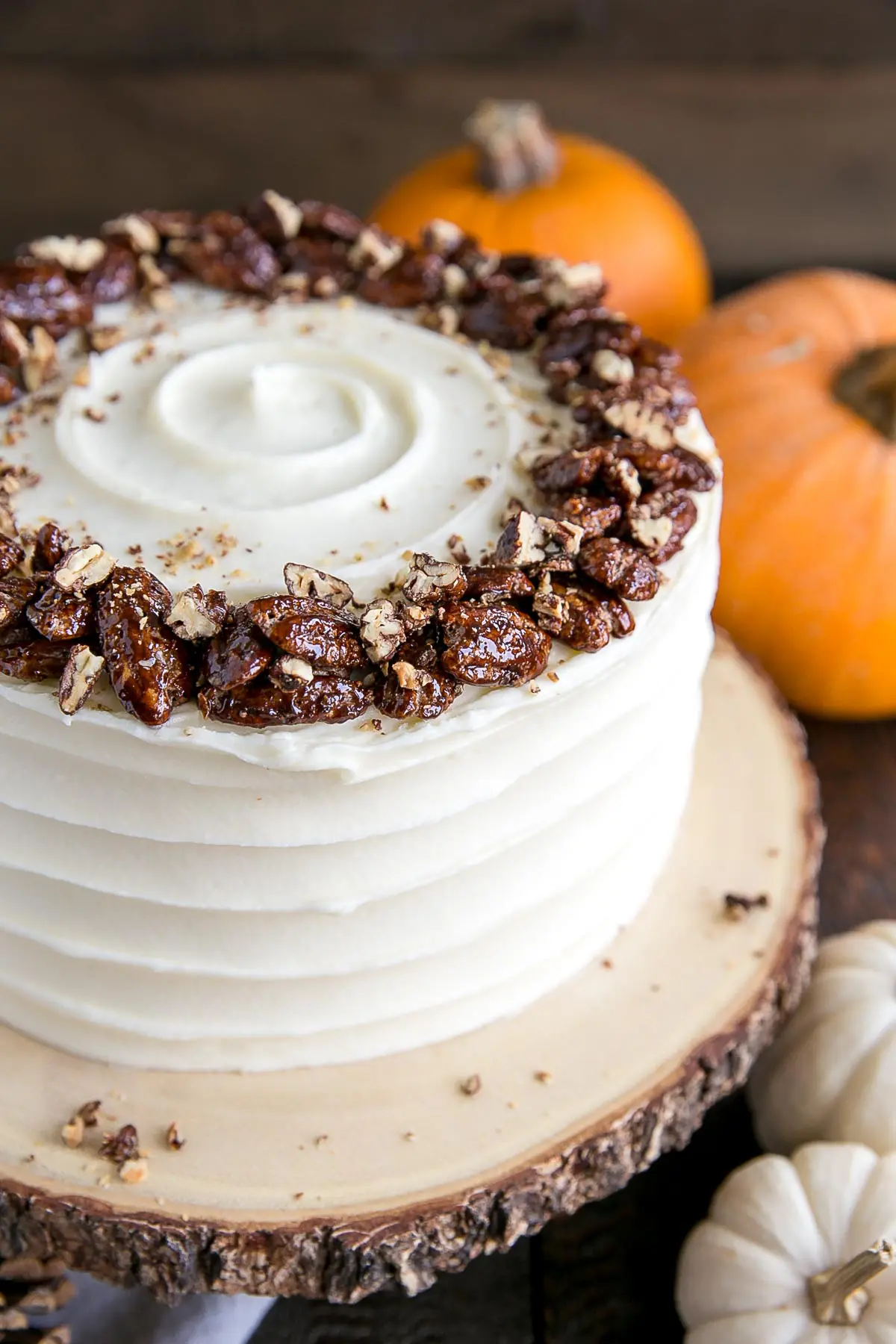 Close up of chopped pecans on top of the cake.