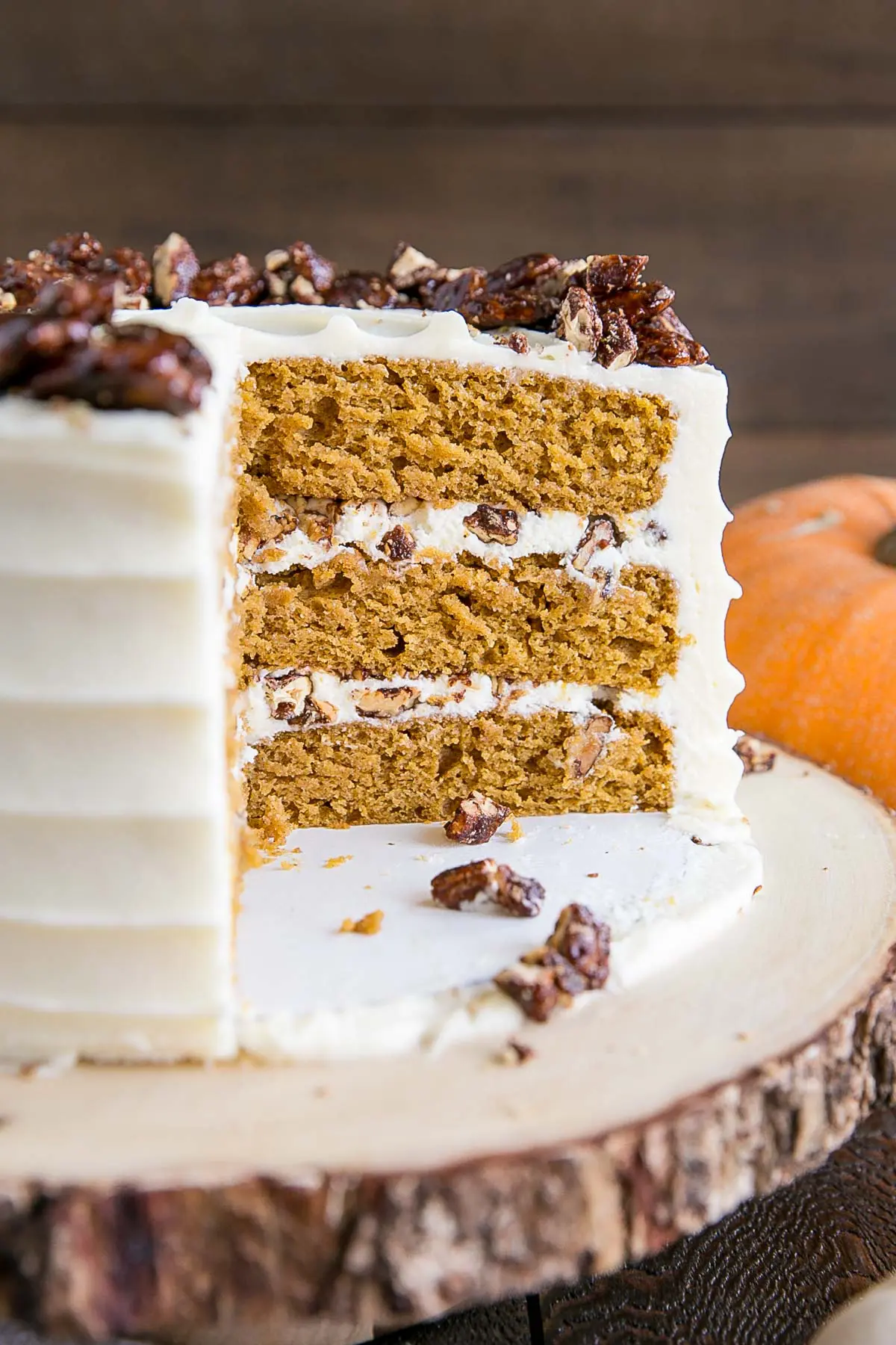 Cross-section of the cake showing the layers and the candied pecans.