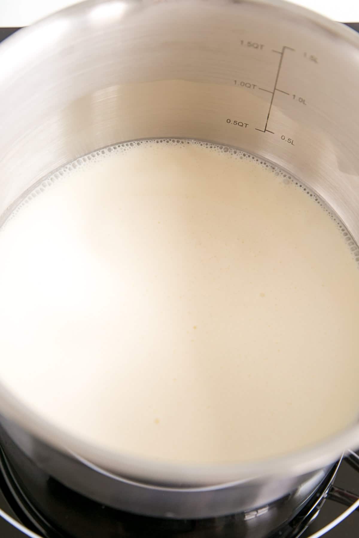 cream simmering in a pot.