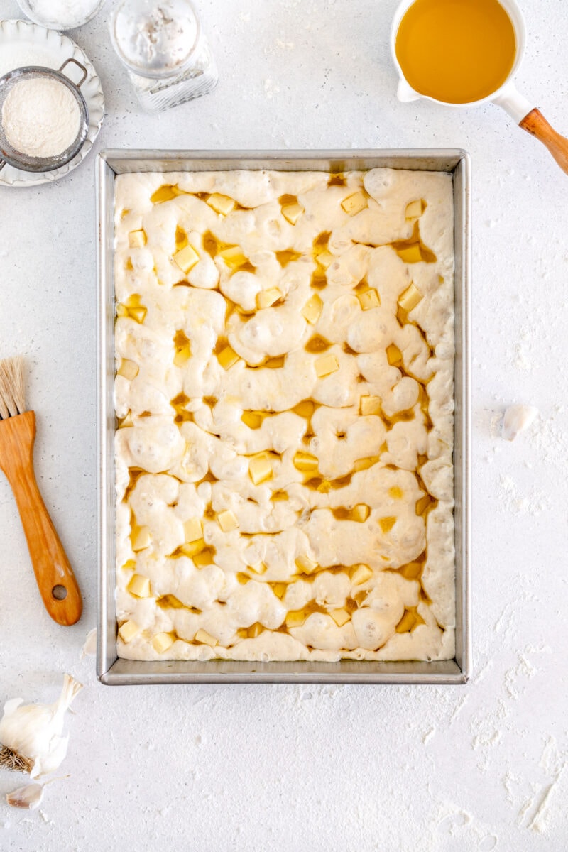 risen bread dough with cheese chunks