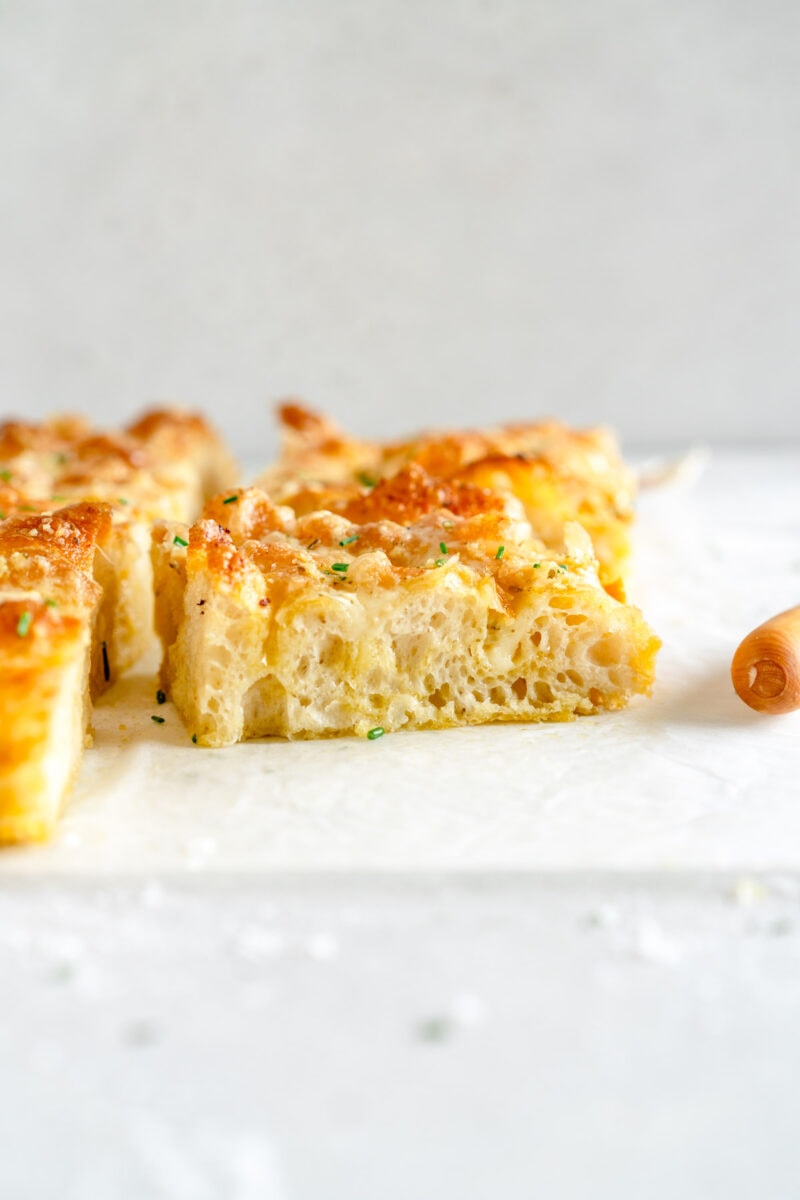 side on shot of baked cheesy garlic bread