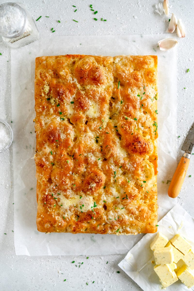 baked cheesy garlic bread on wax paper