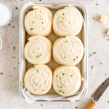 top down shot of buns with pretzel salt and chives